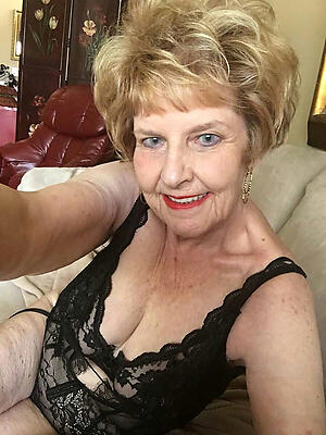 despondent blonde granny posing nude