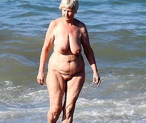 granny at beach stripping