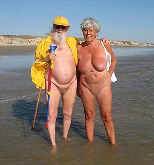 a granny at beach shows us her sexy naked body